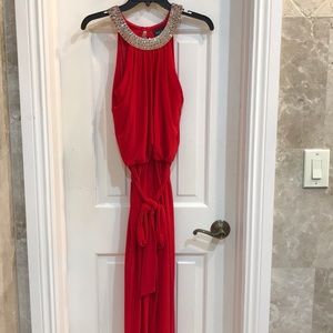 Red jumpsuit.